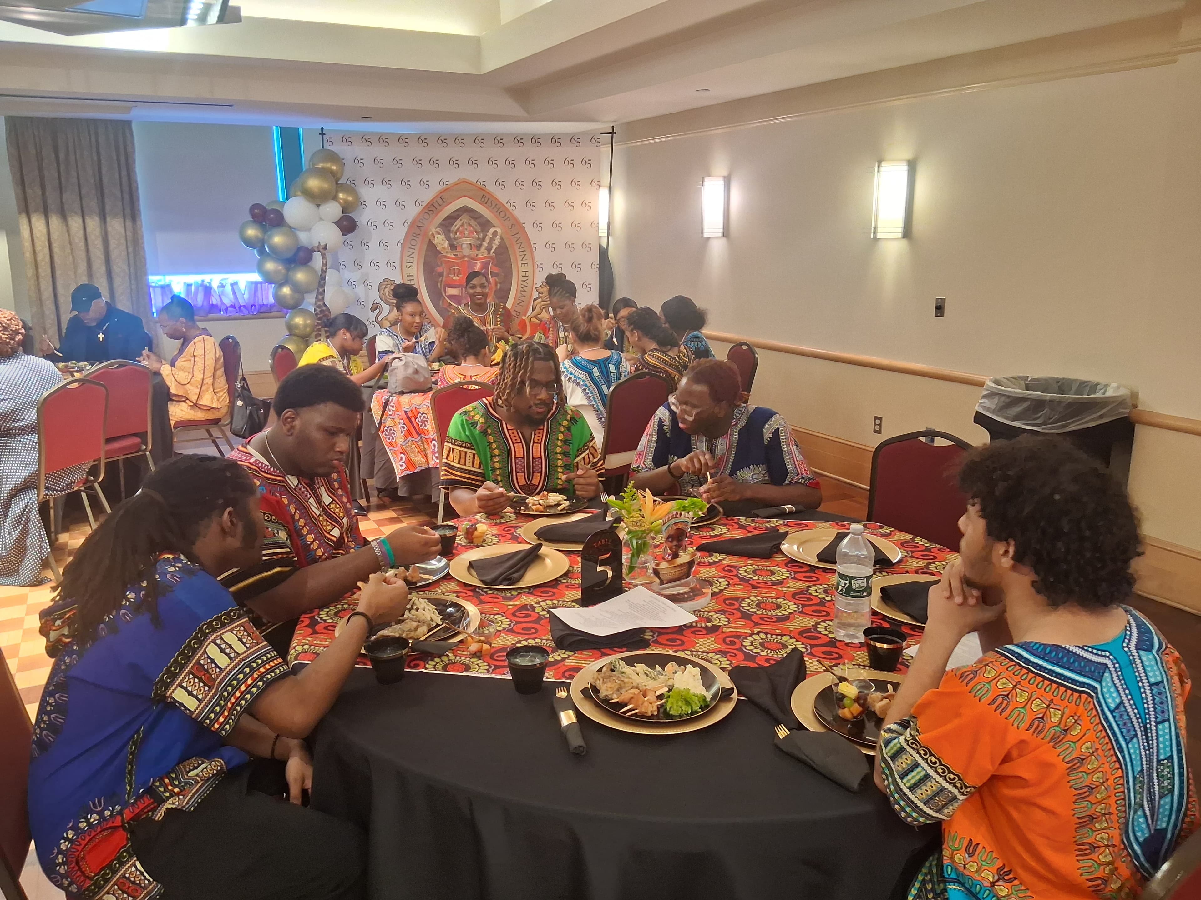 Songs of Solomon cultural arts programming around a table